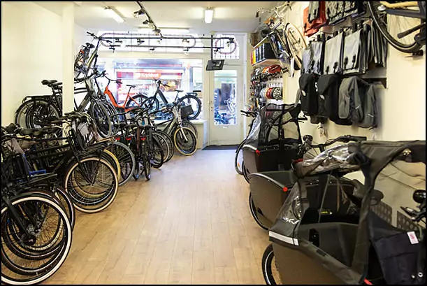 black bikes inside the rental shop in the hague
