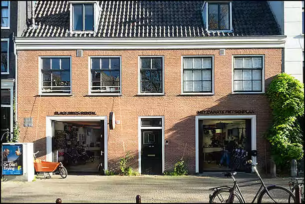 black bikes leidseplein bike rental shop storefront