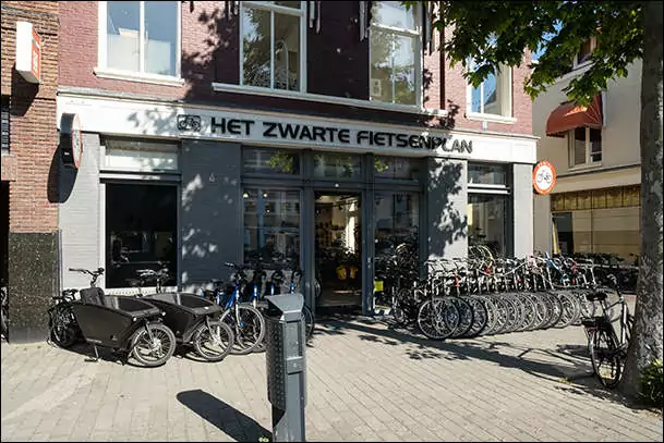 black bikes rental shop haarlem storefront