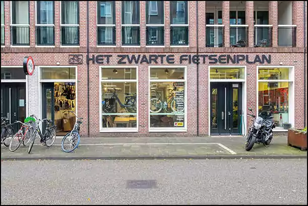 black bikes storefront artis zoo amsterdam